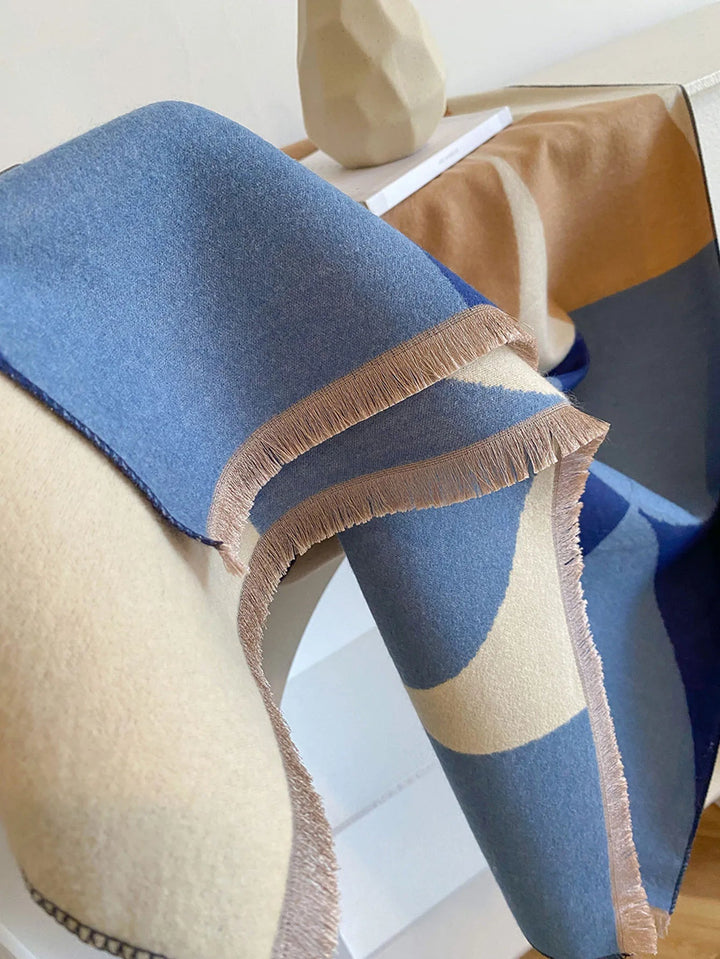 Experience luxury with this women's soft, warm, reversible lilac and black scarf.