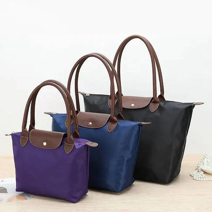 Chic women's luxury shoulder bag with secure zipper, a fashionable and versatile accessory.