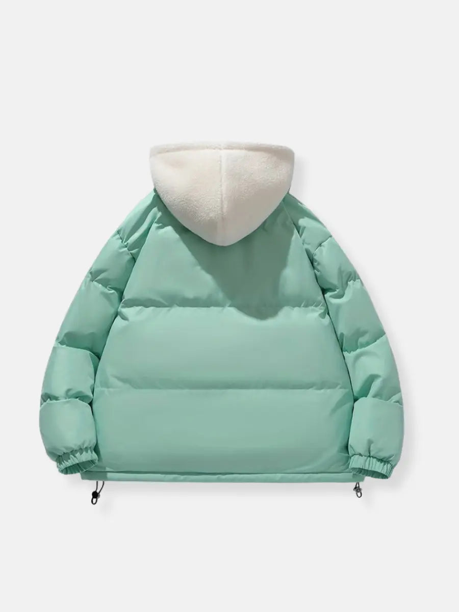 Women's practical puffer jacket, hooded and warm for everyday cold weather activities.