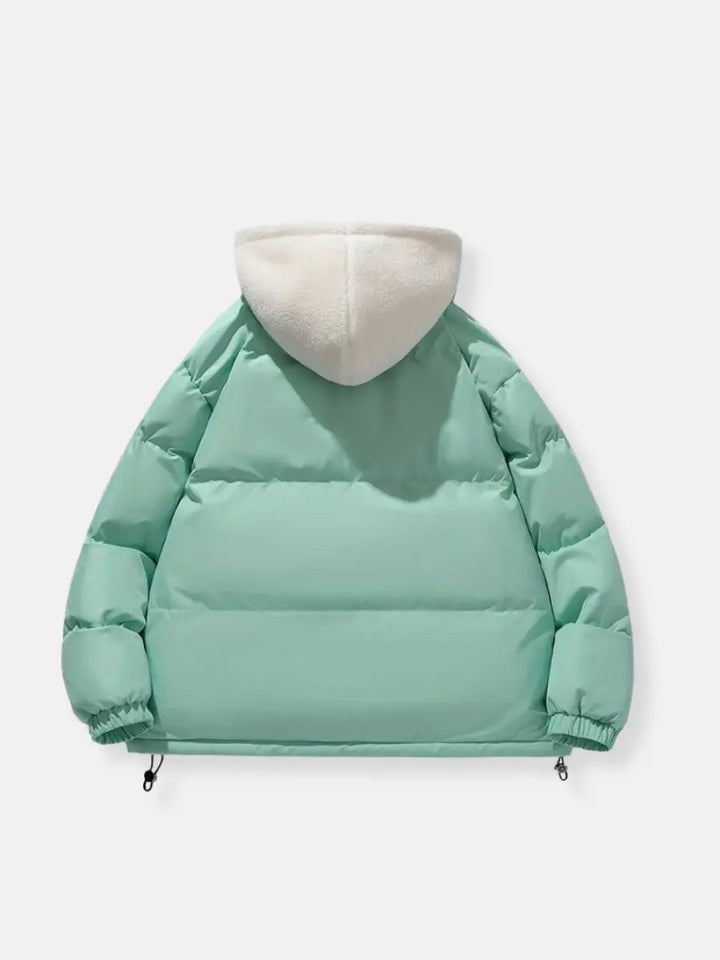 Women's practical puffer jacket, hooded and warm for everyday cold weather activities.
