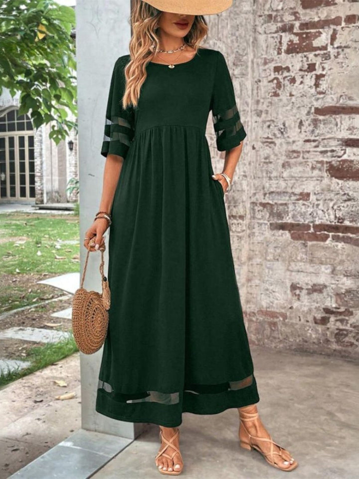 Stylish women's midi dress featuring unique mesh panels & comfortable half sleeves for a flattering fit.