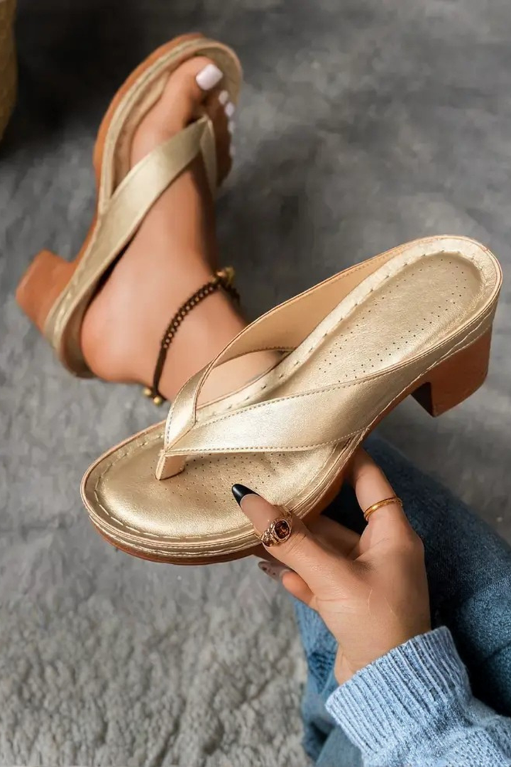 Stylish women's metallic toe post sandals with a stable block heel, perfect summer footwear.