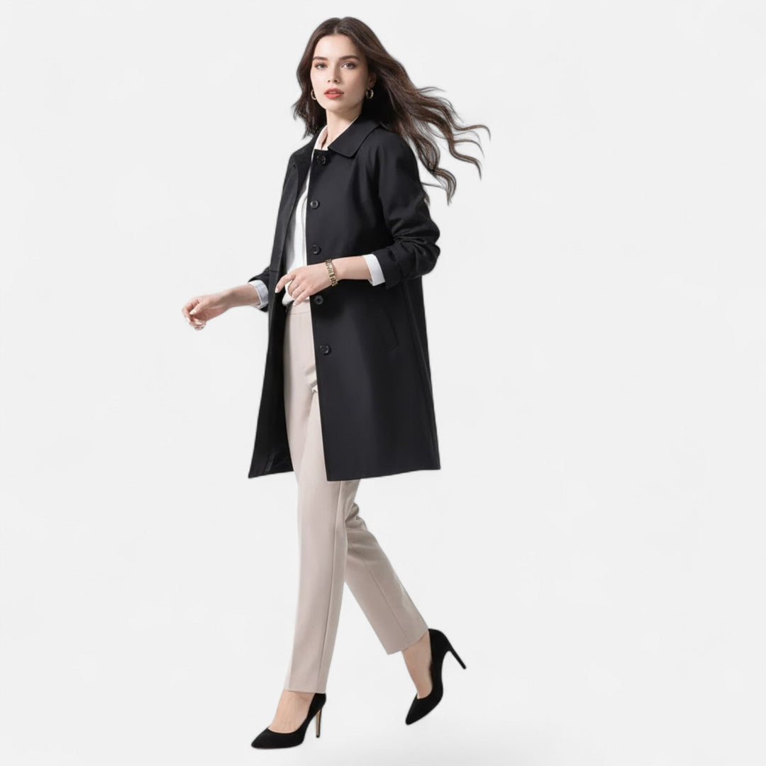 Stylish navy wool-blend trench coat for women, ideal for transitional fashion and layering.