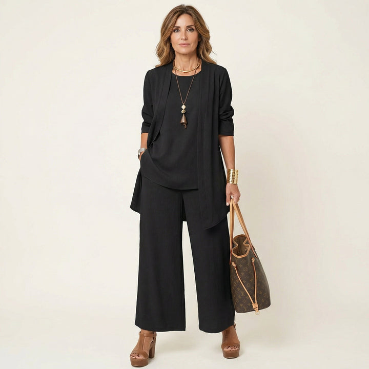 Women's minimalist 3-piece set: vest, blouse, and wide-leg pants for elegant wear.