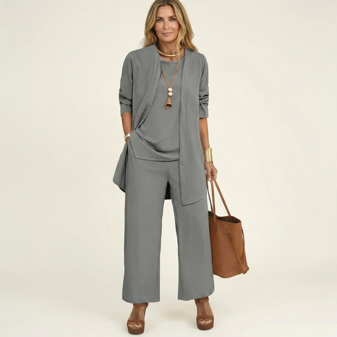 Stylish wide-leg pants, vest & blouse form a women's minimalist 3-piece matching set.
