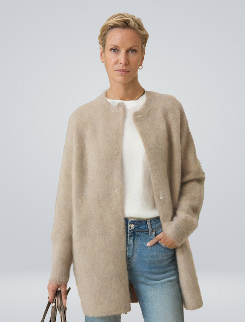 Women's minimalist longline button cardigan, a versatile layering piece for effortless casual chic style.