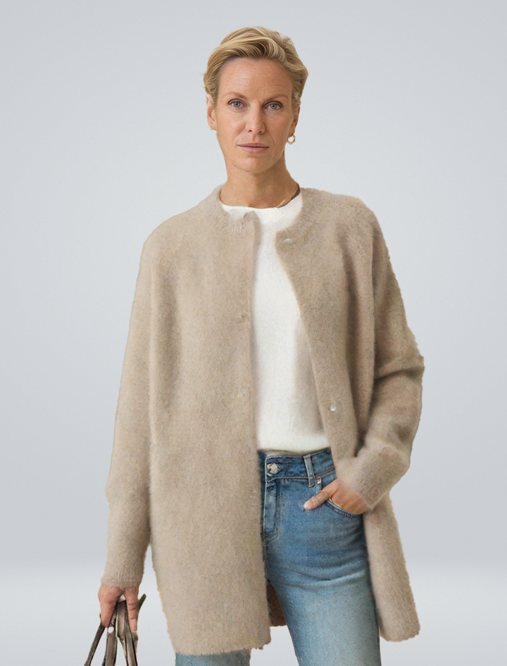 Women's minimalist longline button cardigan, a versatile layering piece for effortless casual chic style.