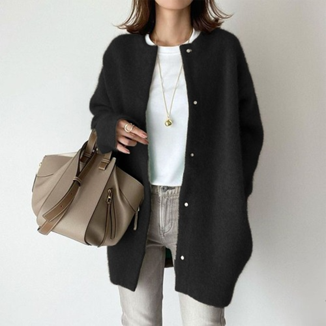 Grey minimalist women's longline button cardigan, offering timeless design and versatile layering for casual outfits.