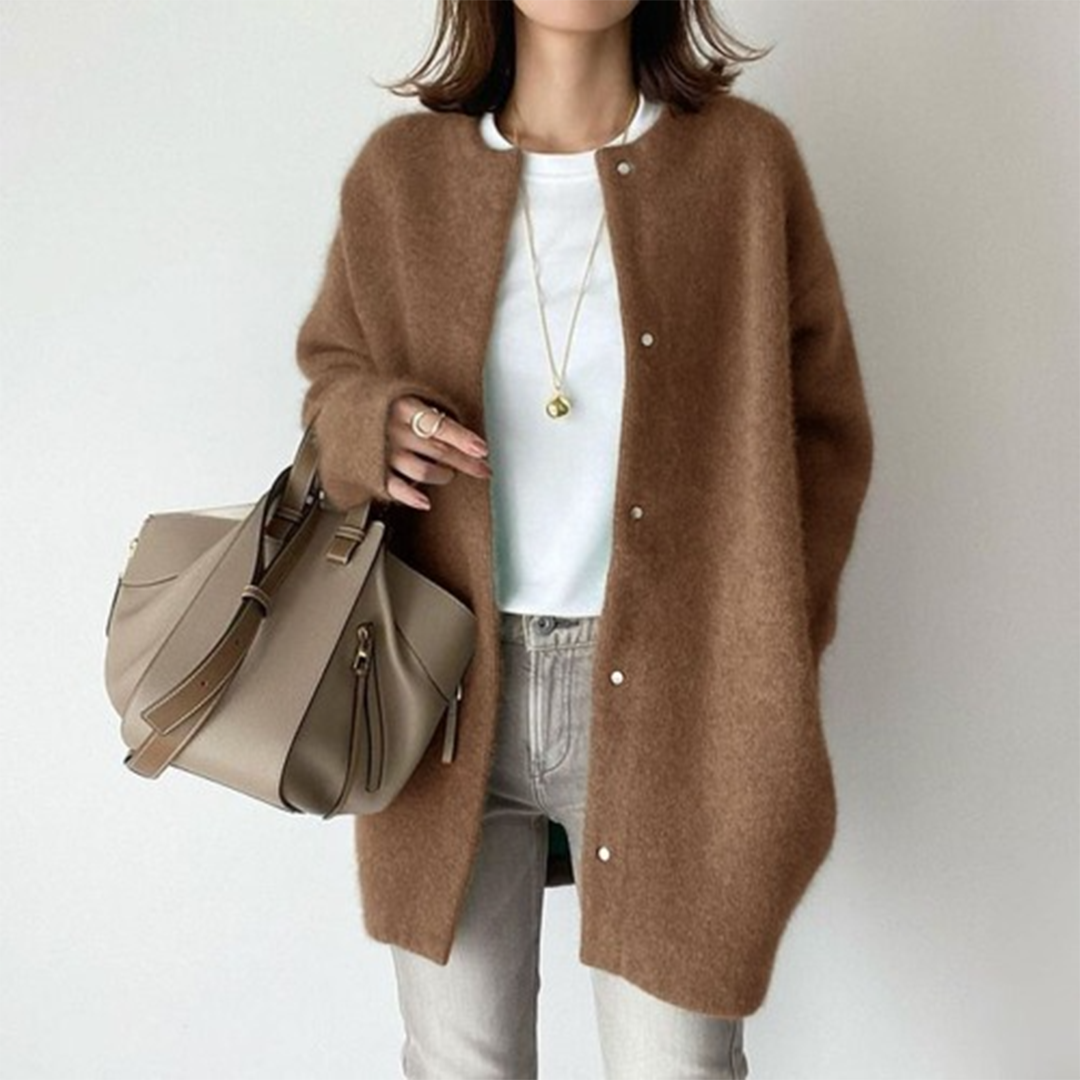 Comfortable women's longline button cardigan, an essential layering piece with a relaxed, minimalist style.