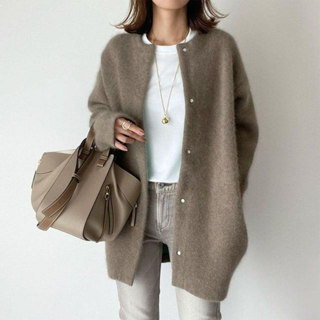 Women's minimalist button cardigan, a longline design for versatile fashion, perfect for spring and fall layering.