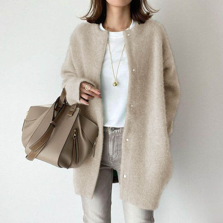 Oversized women's minimalist longline button cardigan, providing everyday comfort and sophisticated casual style.