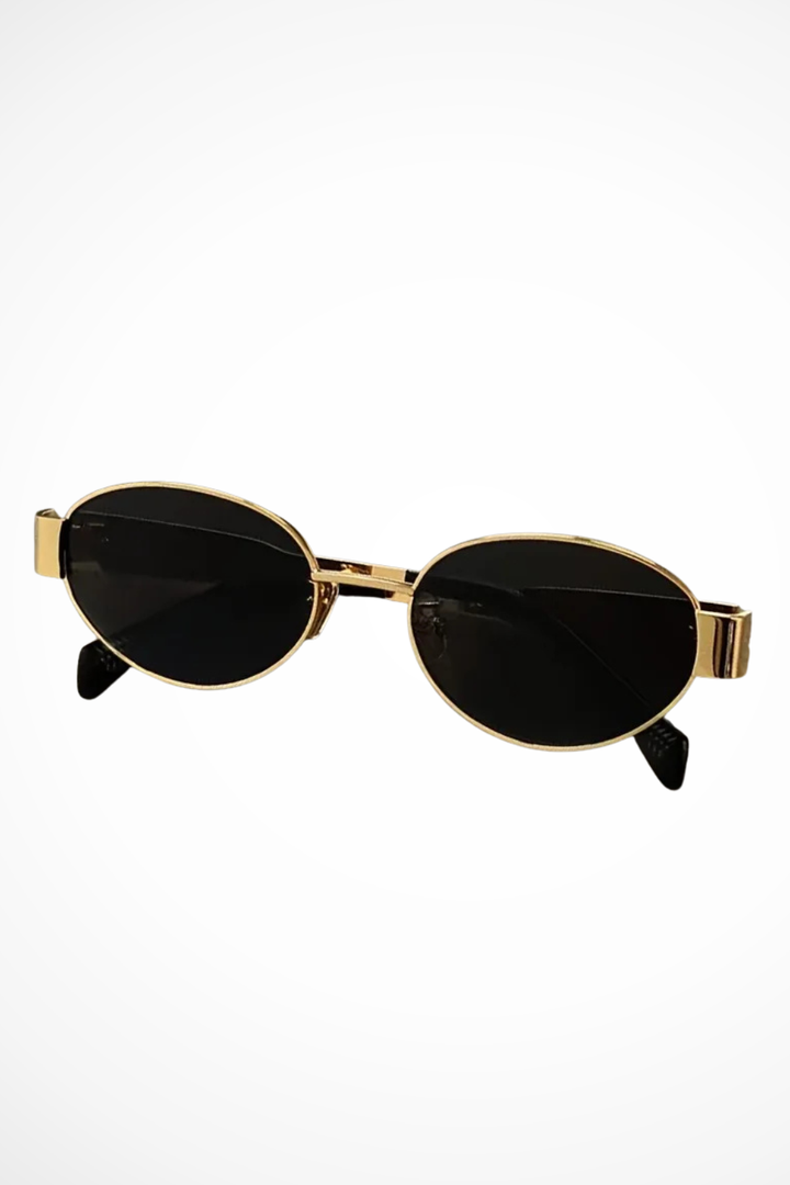 Women's elegant oval metal frame sunglasses. Minimalist design, dark lenses, classic fashion accessory.