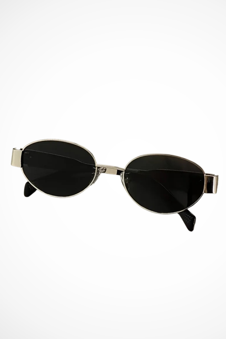 Fashionable women's oval metal frame sunglasses. Elegant, classic & lightweight eyewear with dark lenses.