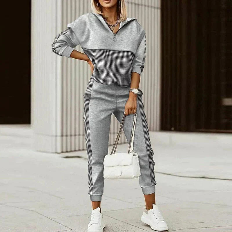 Modern women's zipper top tracksuit. Casual two-piece set, comfortable for everyday wear & stylish activewear.