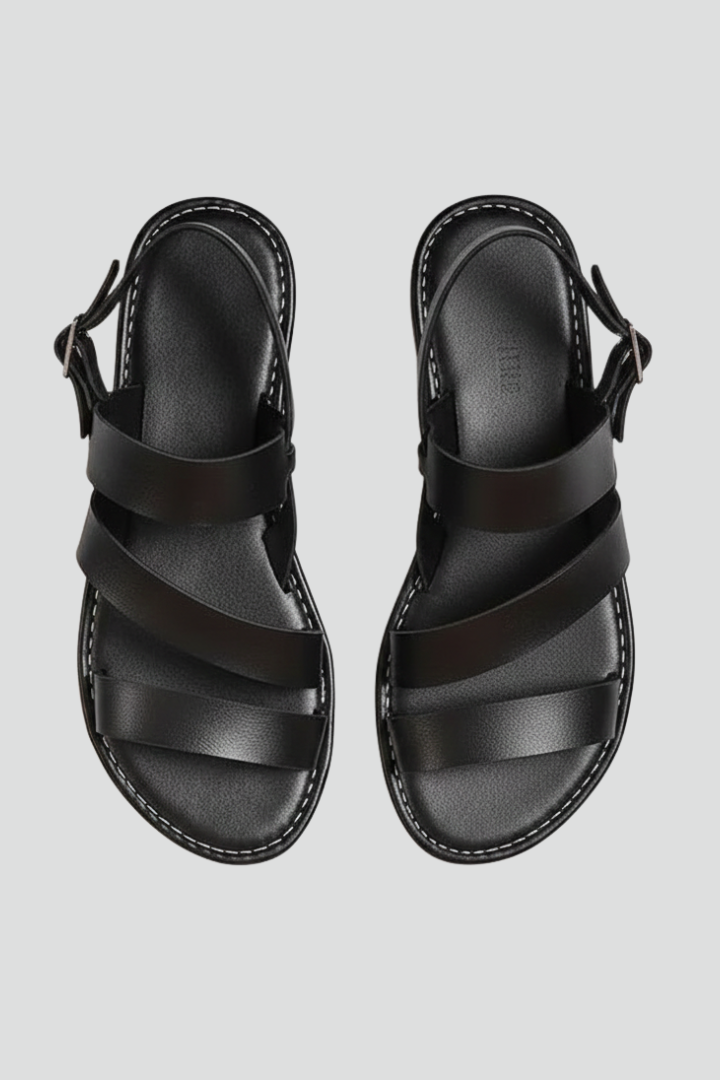 Women's modern flat sandals with secure back strap, perfect for comfortable summer wear.