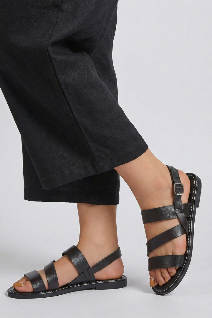 Comfortable women's flat sandals with supportive back strap, open toe design for warm weather.