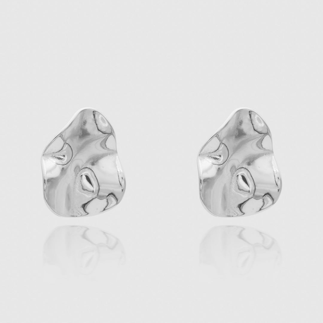 Modern silver plated geometric stud earrings, women's statement jewelry with a sculpted look.