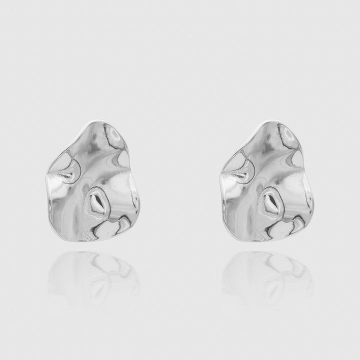 Modern silver plated geometric stud earrings, women's statement jewelry with a sculpted look.