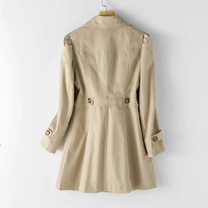 Modern women's trench coat, open collar & button front. Stylish & lightweight outerwear, perfect for spring/autumn fashion.
