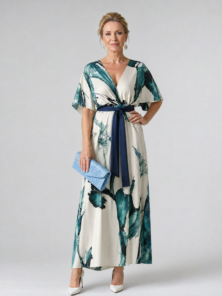 Women's multi-color abstract print maxi dress with flutter sleeves, v-neck, and belt. Perfect for summer.