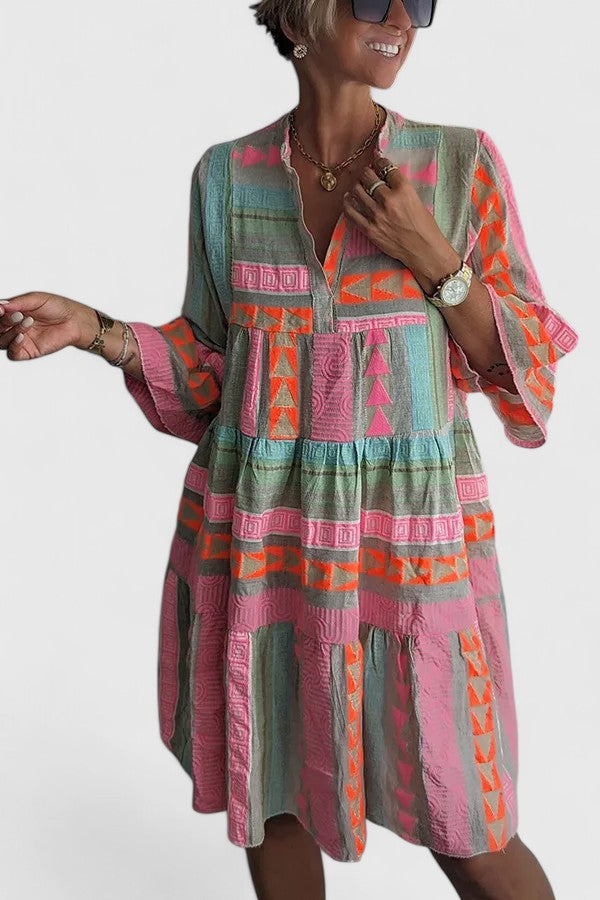 Multi-color flowy tiered swing dress for women. Bohemian style, relaxed fit, comfortable summer or beach wear.