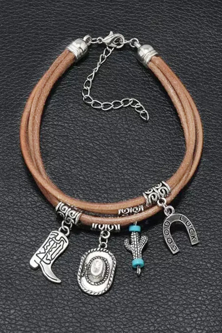 Chic women's western charm bracelet. Layered design with silver hat, boot, and cactus charms. Cowgirl fashion accessory.