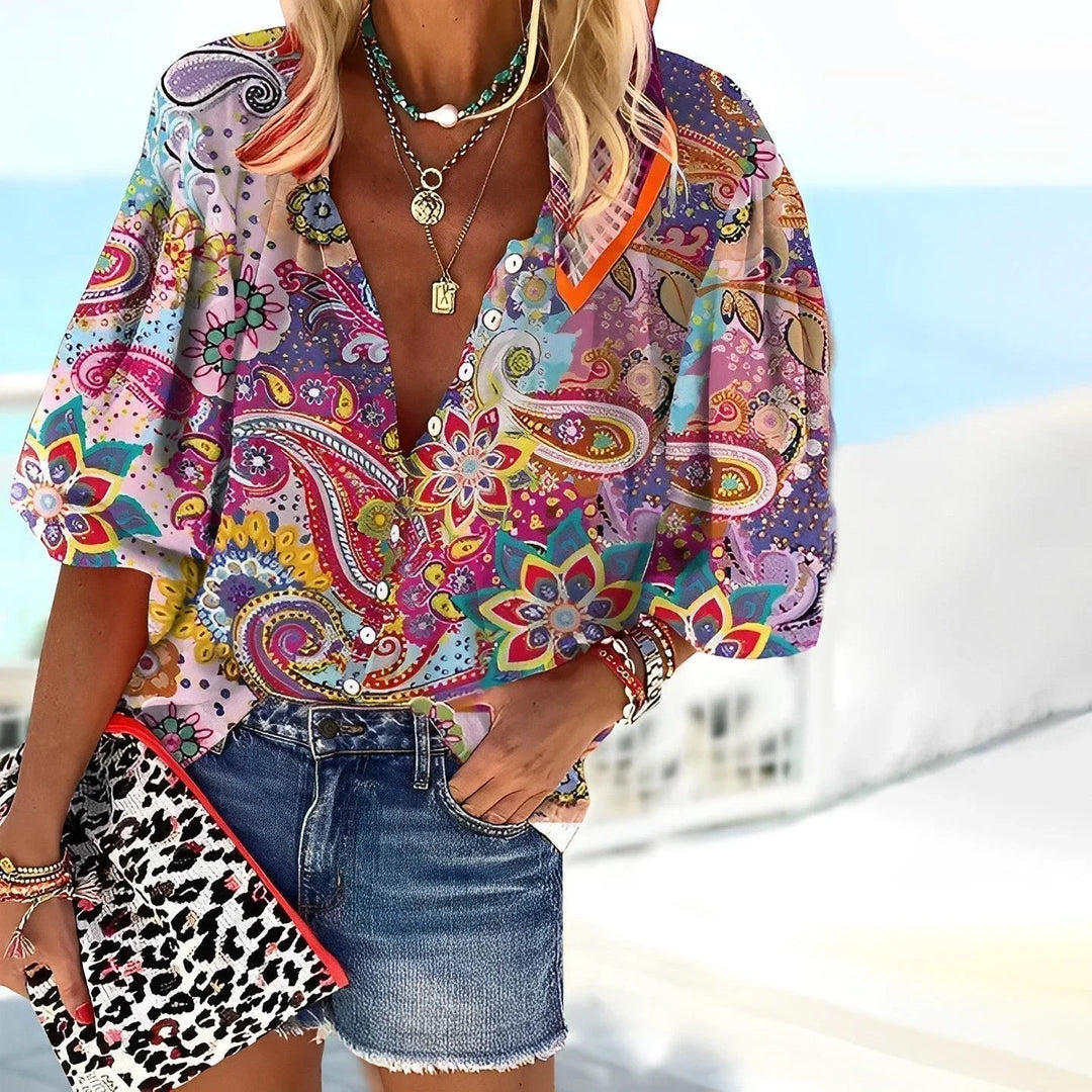 Women's multicolor boho paisley print blouse with a V-neck and puff sleeves, ideal for casual summer wear.