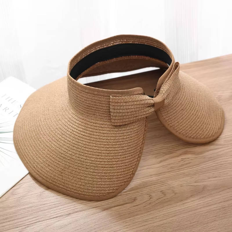 Chic women's wide brim straw visor hat, ideal summer accessory for beach & outdoor activities.