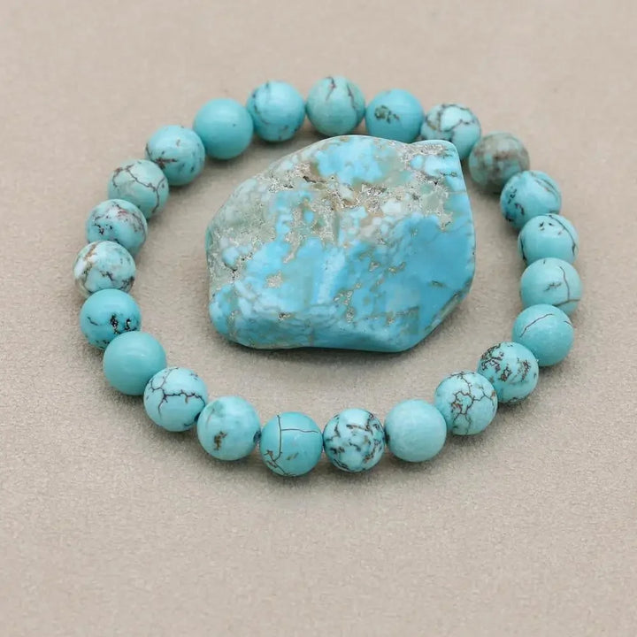 Women's natural turquoise beaded stretch bracelet, a vibrant gemstone fashion accessory for her.