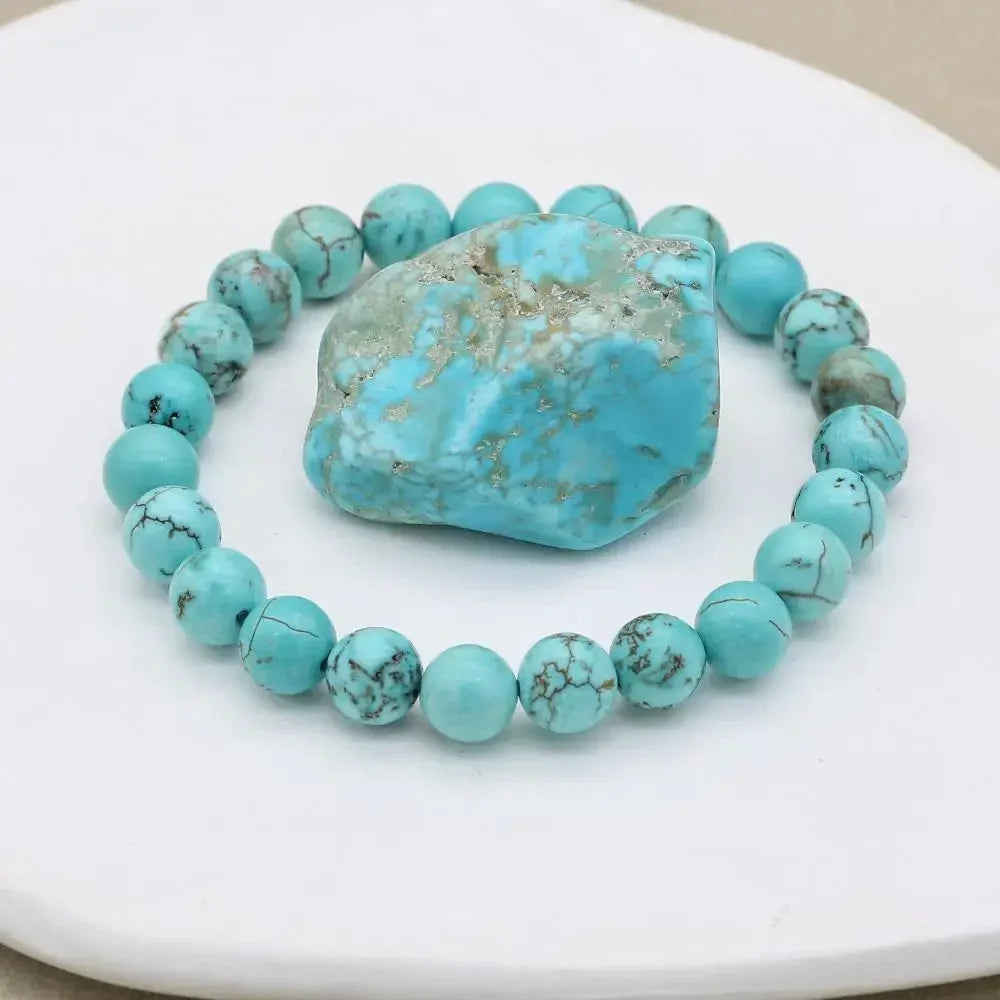 Vibrant natural turquoise beaded stretch bracelet for women. Elegant gemstone jewelry accessory.
