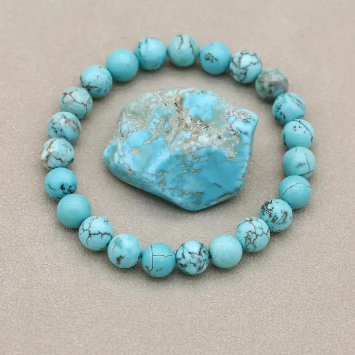 Comfortable women's stretch bracelet featuring natural turquoise gemstone beads. Stylish jewelry piece.