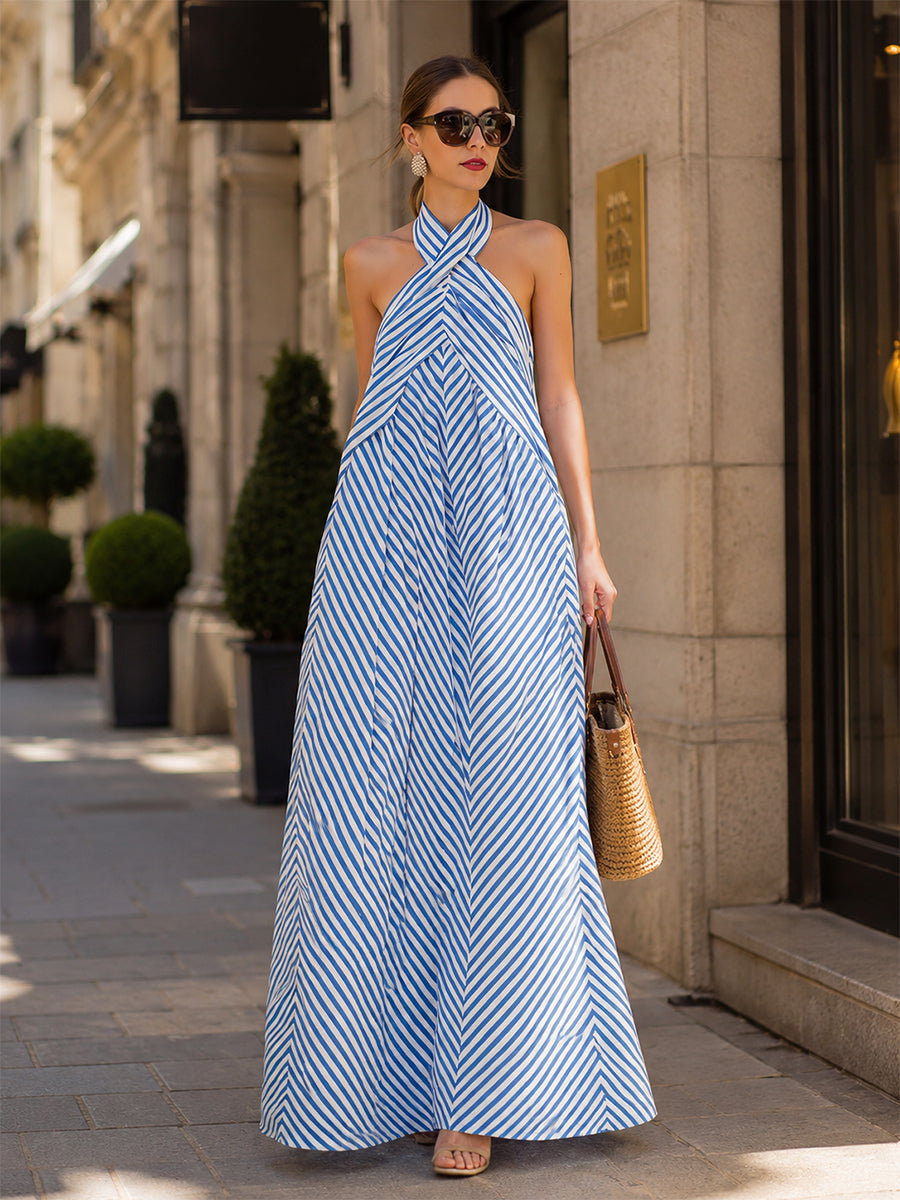 Women's sleeveless maxi dress with nautical stripes and a stylish halter neck. Ideal for summer fashion.