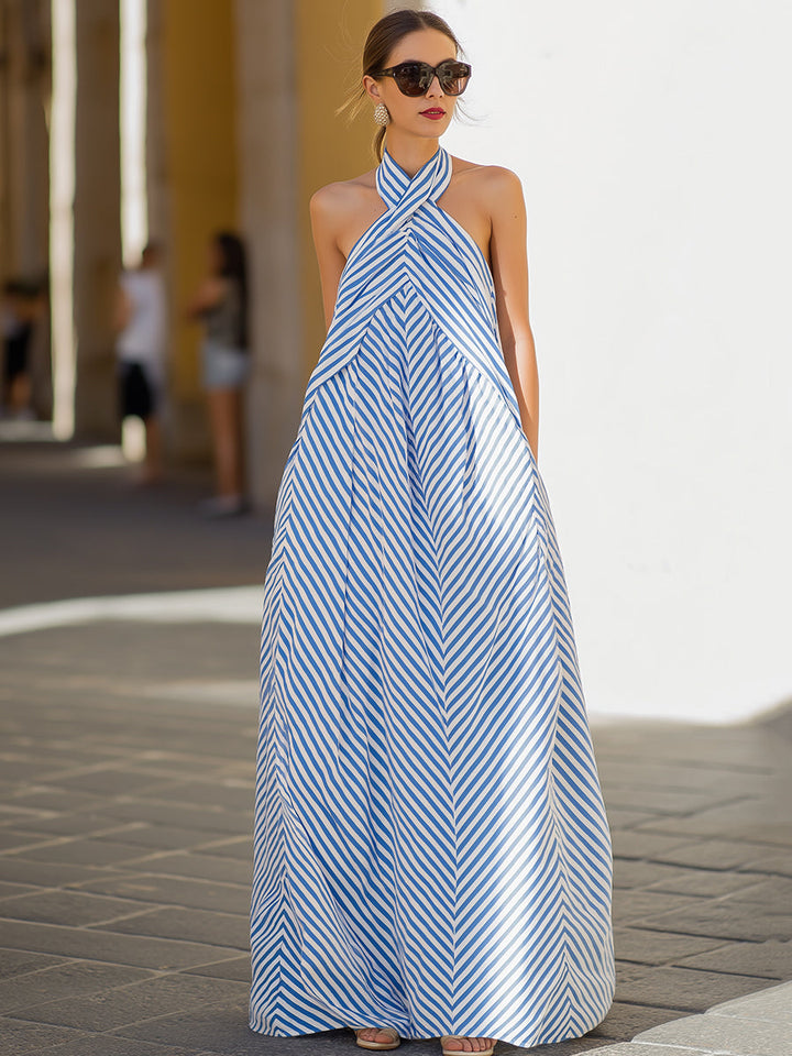 Elegant women's nautical stripe maxi dress with a flattering halter neck design, perfect for summer events.