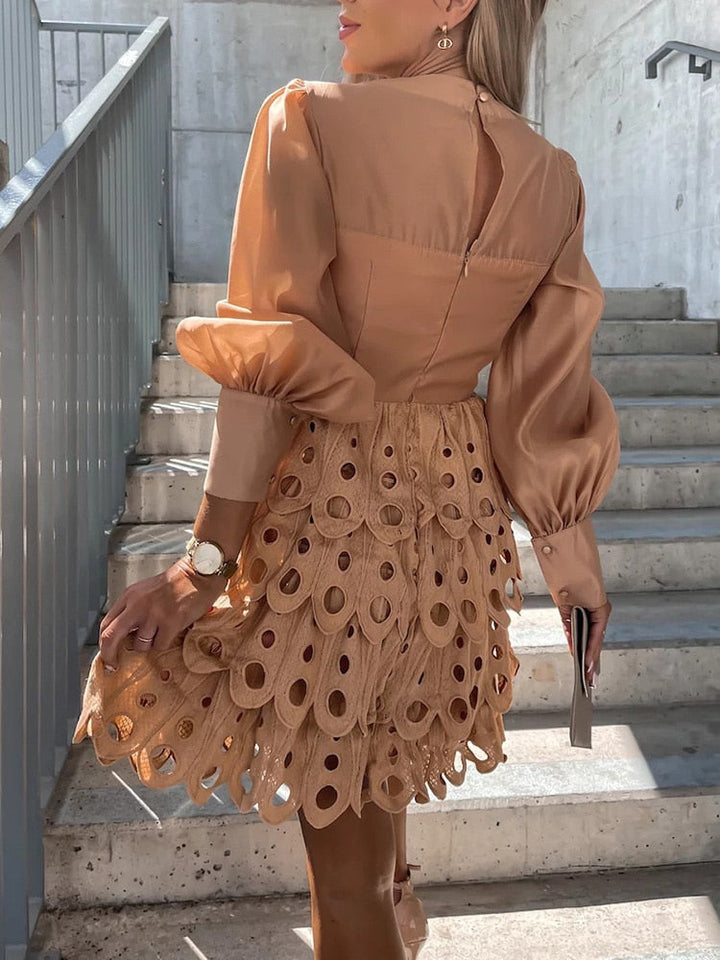 Versatile neutral tone mini dress with unique embroidered details and sheer cutwork sleeves