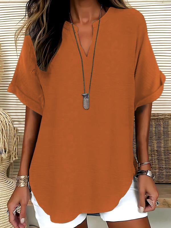 Lightweight & flowy women's notched V-neck blouse, a comfortable short sleeve summer top for casual elegance.