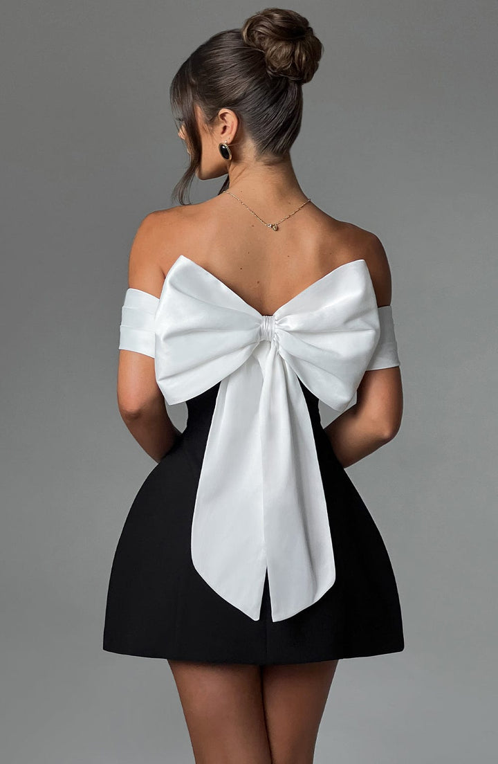 Flared off-shoulder mini dress for women, with a stylish bow back, ideal for parties & special occasions.