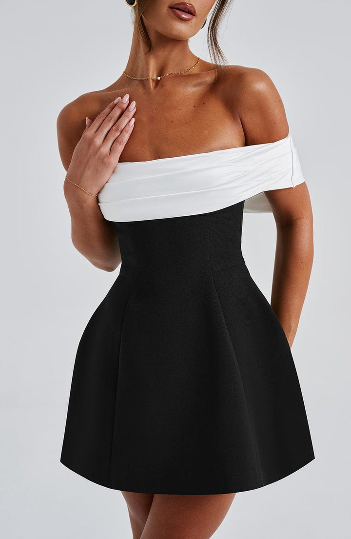 Black women's off-shoulder mini party dress, flared silhouette & a beautiful bow back. Special occasion.