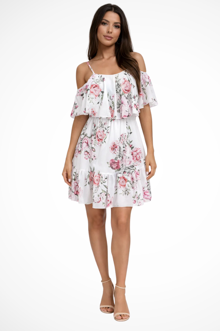 Stylish boho off-shoulder mini dress with a floral design and ruffles. A comfortable and chic summer party or vacation outfit.