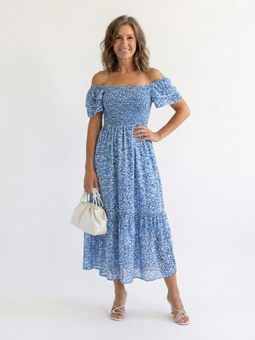 Chic women's off-shoulder floral smocked midi dress, featuring a flattering fit and trendy puff sleeves.