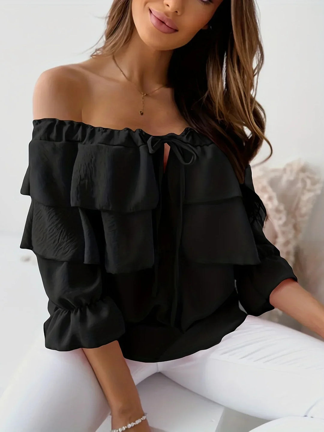 Women's off-shoulder tiered ruffle long sleeve blouse with tie-front. Smart casual & elegant style.