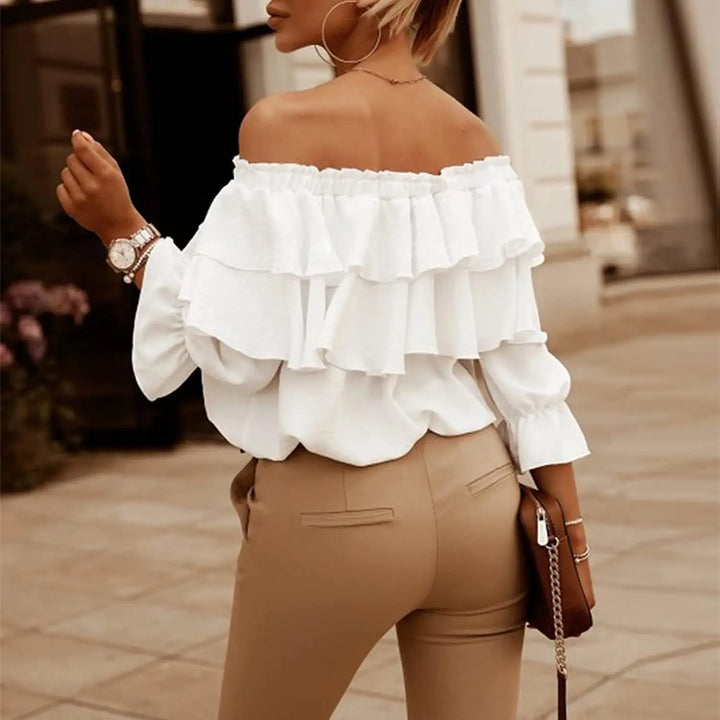 Stylish off-shoulder women's top with tiered ruffles, long sleeves, and a fashionable tie-front design.