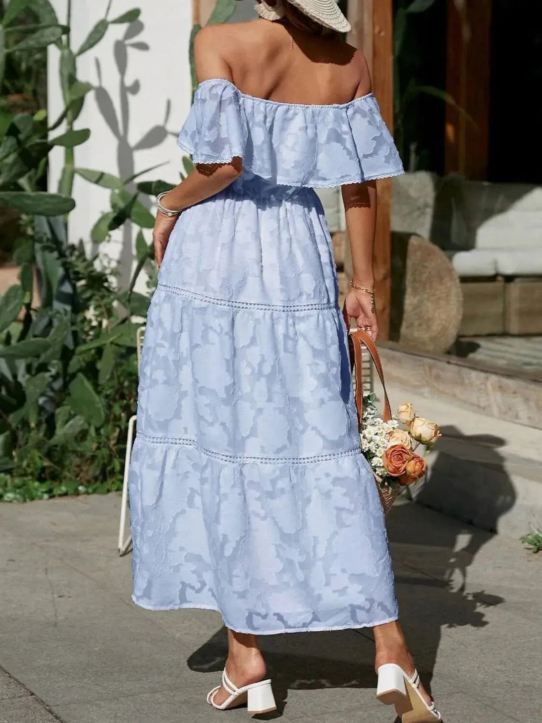 Vibrant off-shoulder tiered ruffle maxi dress, ideal for beach outings and leisurely summer days.