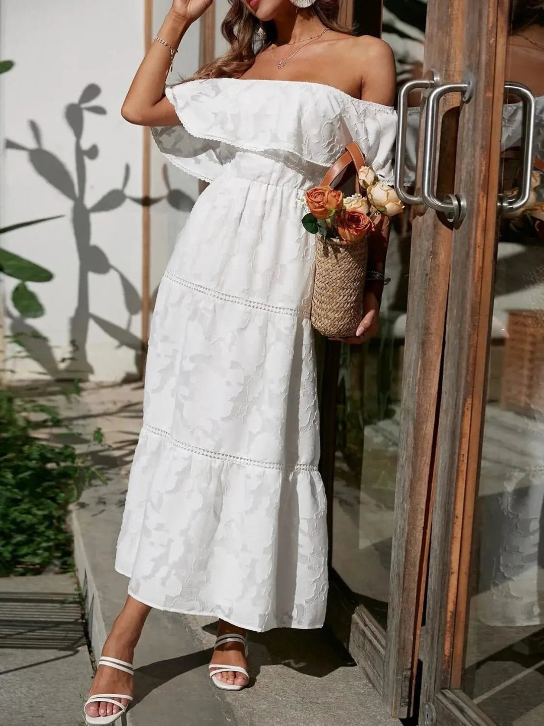 Beautiful tiered ruffle off-shoulder maxi dress, embodying summer grace for any event.