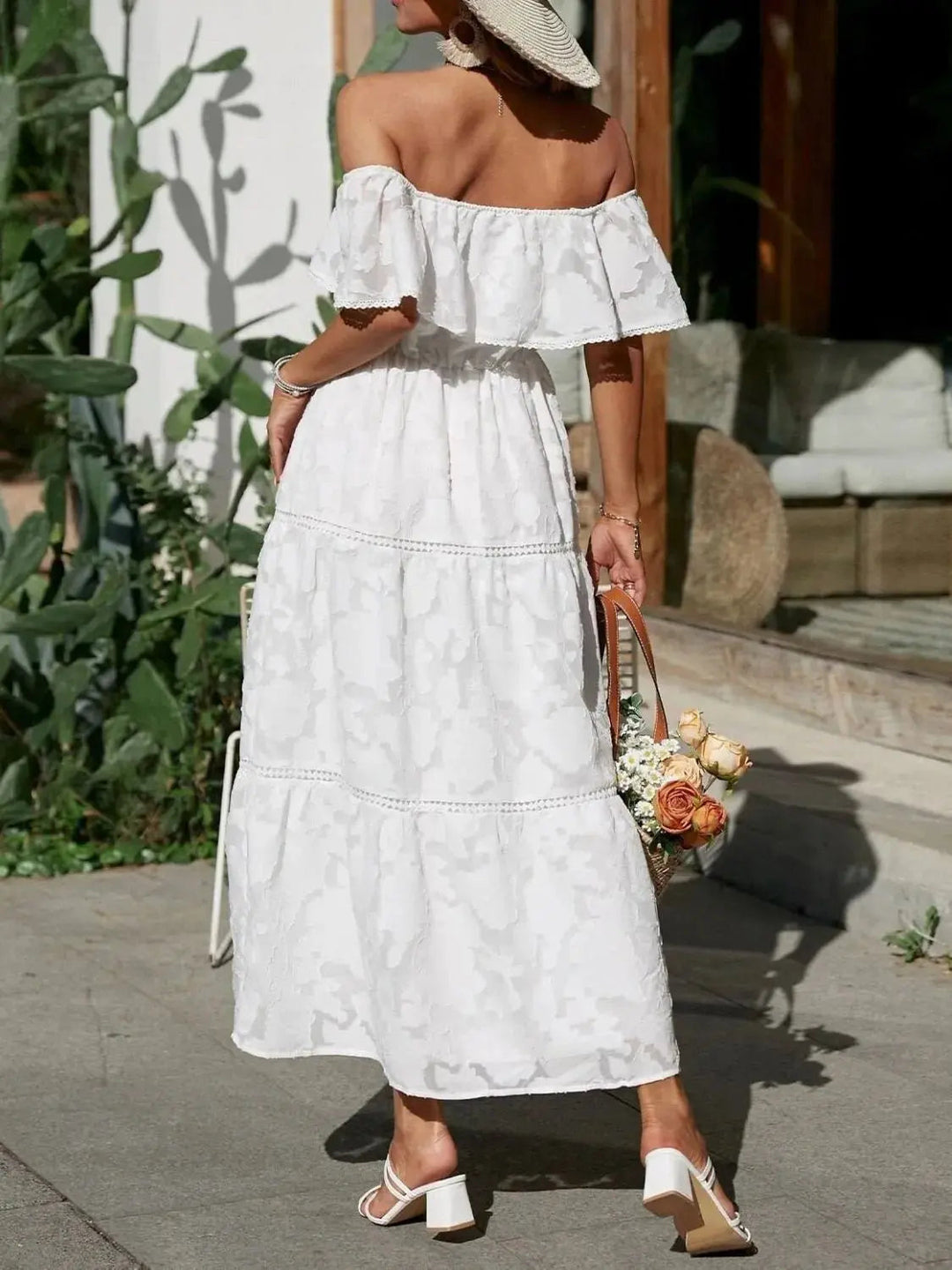 Chic women's off-shoulder maxi dress, featuring tiered ruffles for a sophisticated summer style.