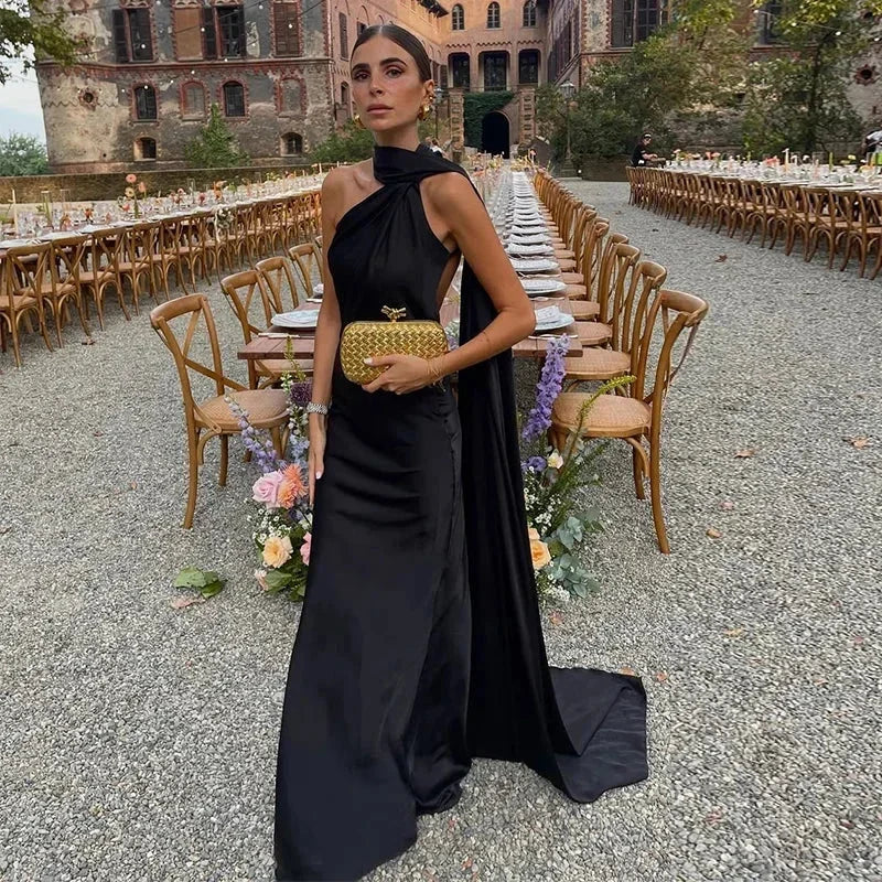 Women's one-shoulder draped backless maxi dress, elegant for evening wear.