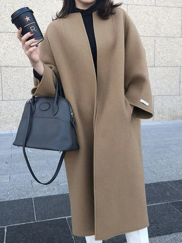 Women's open front long coat in a classic style, offering cozy warmth and effortless elegance.