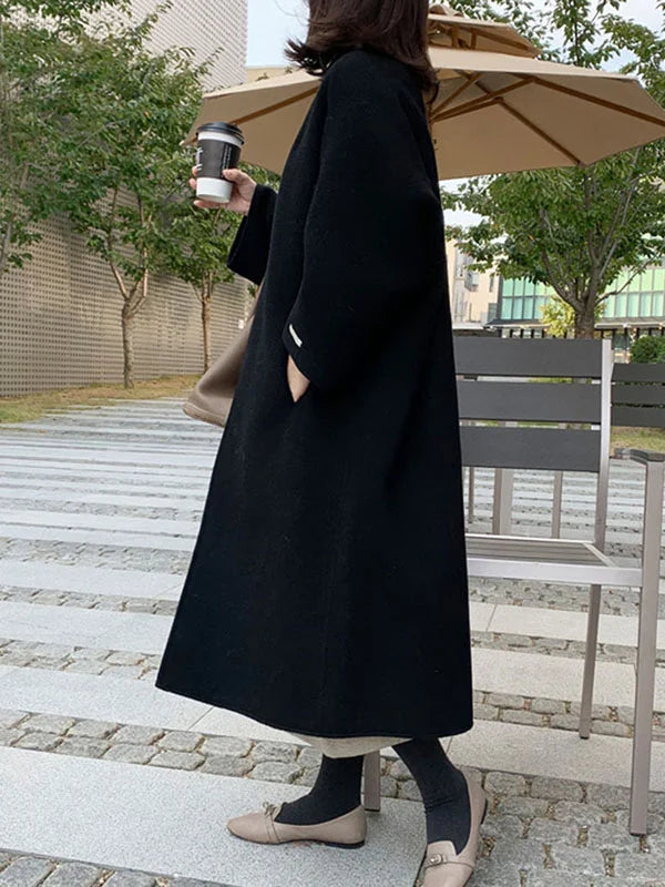 Fashionable open front long coat for women, ideal for layering and adding a touch of casual elegance.