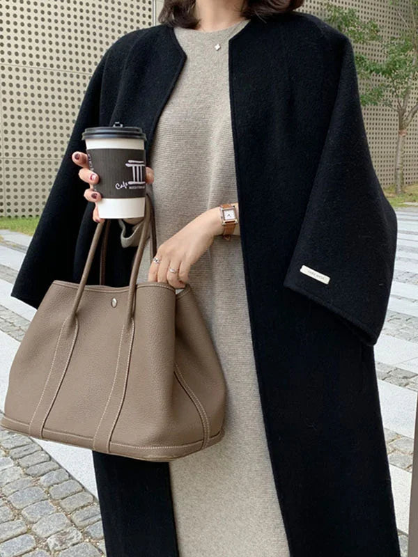 Women's oversized open front long coat, designed for both style and cozy warmth during colder seasons.