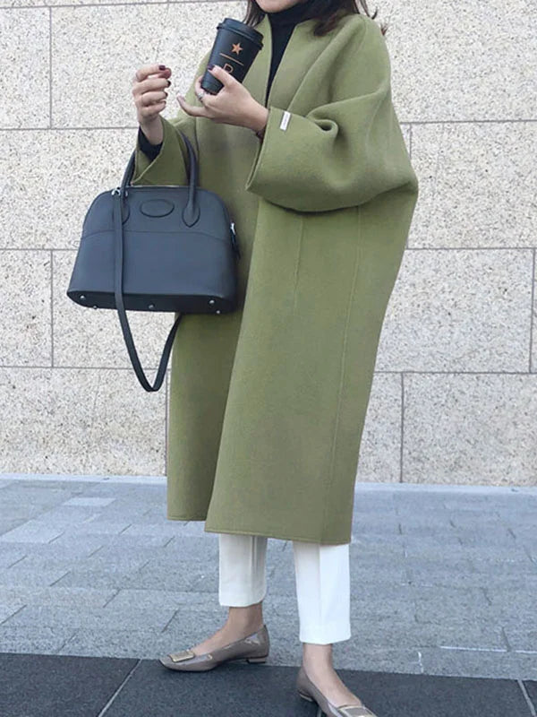 Cozy women's fashion: an open front long winter coat providing warmth and a stylish, relaxed fit.