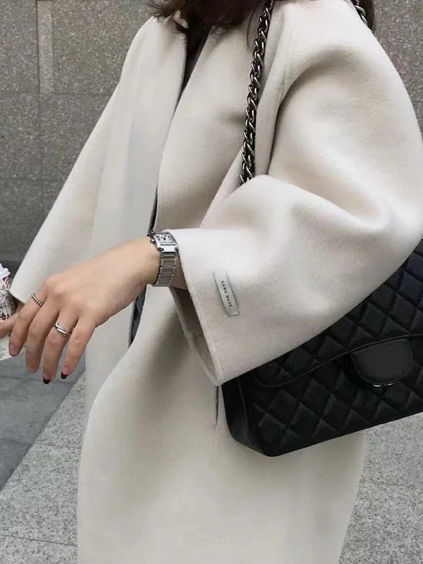 Elegant women's casual coat, a long open front design that combines warmth with modern fashion.